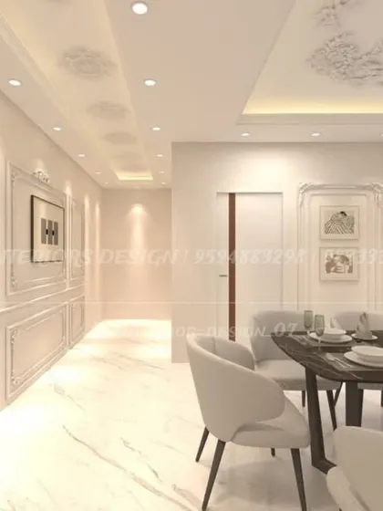 An elegant dining space featuring classic wall molding and ornate ceiling details. The all-white theme creates a bright and sophisticated atmosphere, perfect for formal dining.