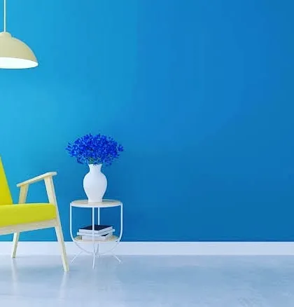 A single accent wall can completely change the feel of a room. We can help you choose and apply a vibrant color, like this rich blue, to create a stylish and modern focal point in your living space.