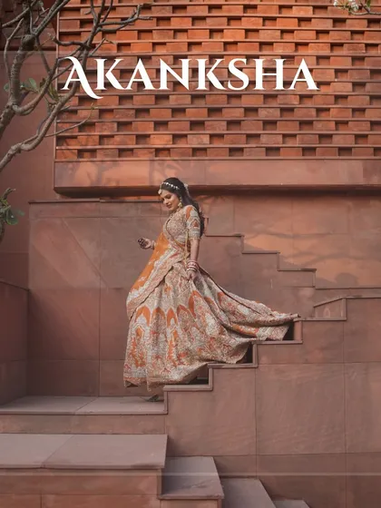 Grace and beauty personified. Our bride descending the steps at a beautiful heritage location, her lehenga flowing behind her.