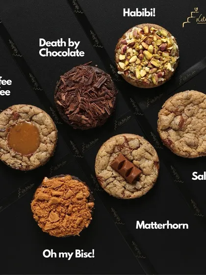 My cookies tell a story. This is my 'Love at First Bite' collection, with unique flavors like 'Habibi' inspired by Dubai's viral chocolate, and 'Salty AF' which is a perfect mix of Nutella and sea salt.