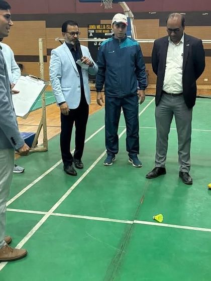 The official start of the competition. Dignitaries conduct the ceremonial first serve to inaugurate the badminton matches for the Inter-Faculty Tournament.