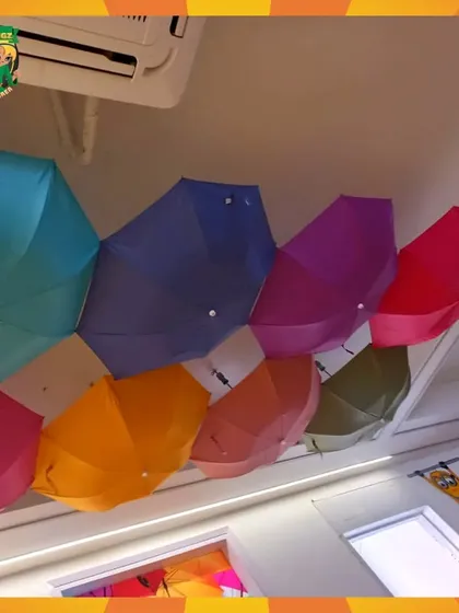 A view of the unique ceiling decorated with colorful, open umbrellas. It's one of the quirky design elements that makes my space memorable.