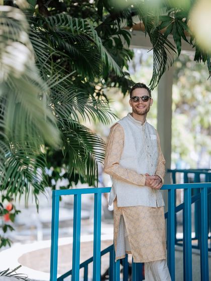 The groom looking sharp and relaxed in his Haldi attire. I coordinate outfits and decor to ensure a cohesive and stylish look for all wedding events.