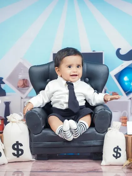 A more playful side of the Boss Baby, captured in his tiny leather armchair.