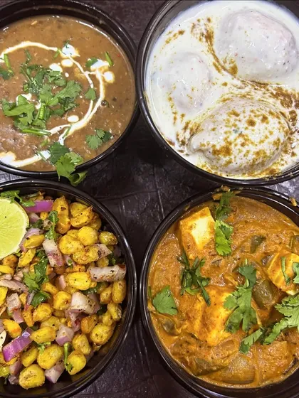 A beautiful spread of some of my popular dishes: Crispy Corn, Dahi Bhalla, Dal Makhni, and Kadai Paneer.