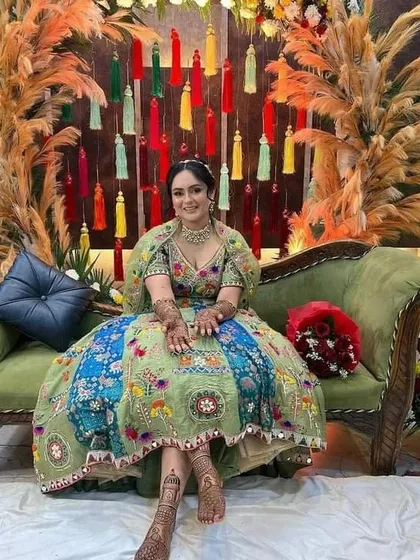 Another shot of the beautiful bride at her ceremony, showcasing her stunning outfit and our complementary mehndi design.