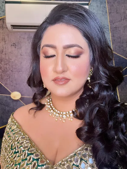 A close-up of the eye makeup for this cocktail look. The soft brown and gold tones are blended to perfection for a sultry effect.