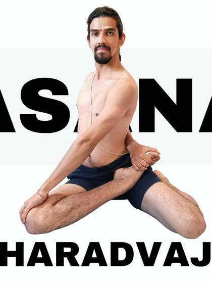Bharadvajasana, a seated twist dedicated to the sage Bharadvaja. This pose improves spinal flexibility.