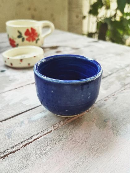 Look at the beautiful creations from this student who completed the intense potter's wheel course. Each piece is a masterpiece, adorned with colorful glazes and intricate, hand-painted details.