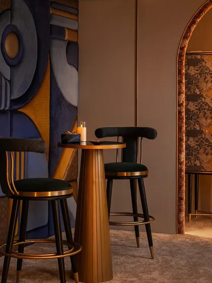 This quiet corner is our nod to the Art Deco era, featuring custom-designed bar chairs and a striking fabric-wrapped wall panel. It demonstrates how we integrate different design languages to create varied, yet cohesive, experiences within a retail environment.