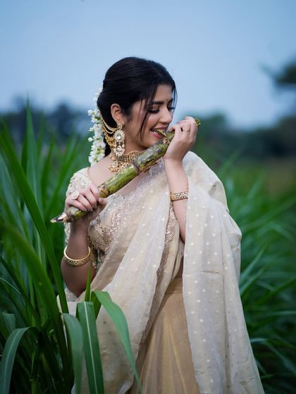 A joyful shot of a model in a sugarcane field, celebrating the harvest festival of Makar Sankranti. This is how I blend tradition with beautiful landscapes.