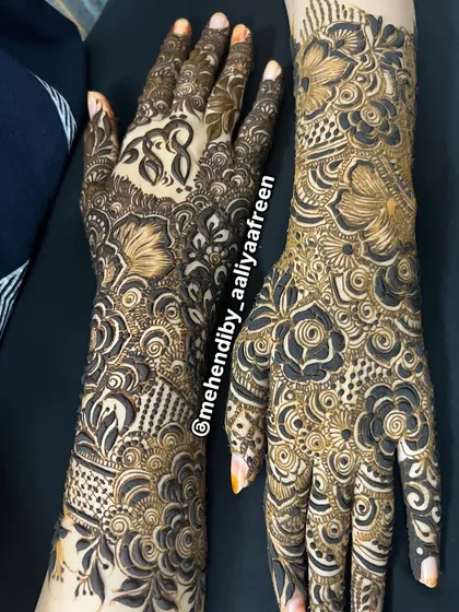 A different perspective of this intricate full-arm design, showing the detail work on the back of the hands.