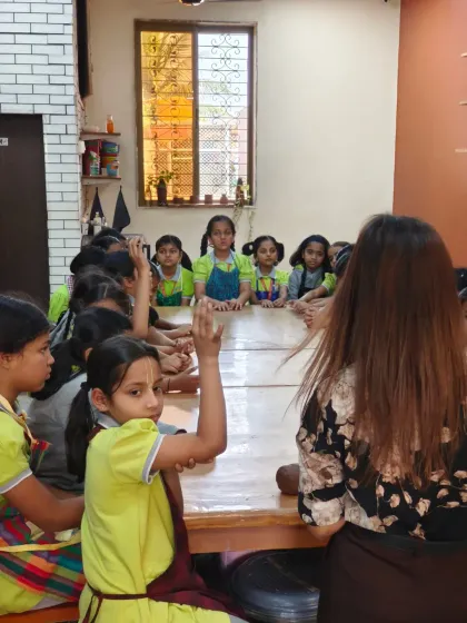 We love hosting school groups like these students from Gopal's Garden School. Here, an instructor engages with the children, answering their questions and giving them a hands-on introduction to the world of pottery.