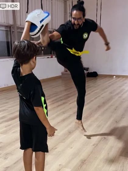 You can do more than you think you can. A coach shows off a flying kick, demonstrating what's possible with dedication.