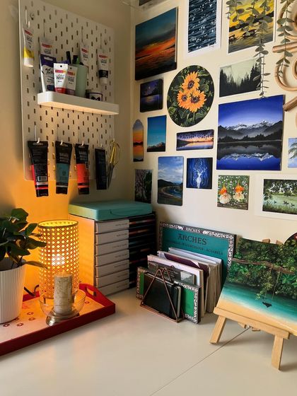 My studio corner at night, with the warm glow of a lamp.