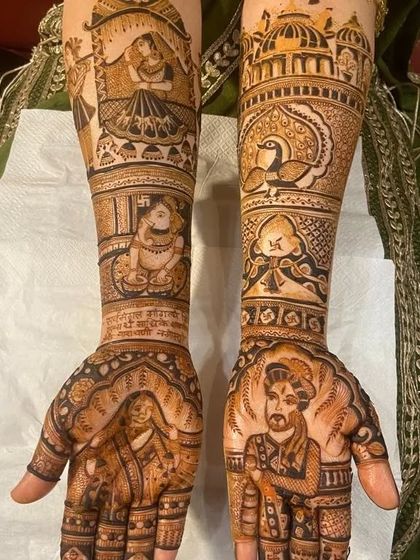 This design includes a portrait of the groom, a doli scene, and a depiction of Ganesha for blessings.