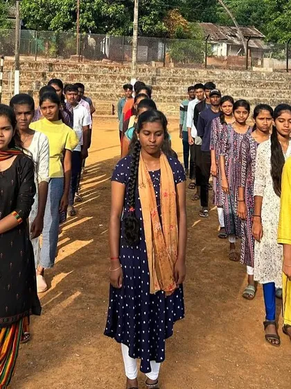 Female participants from the KRIES camp stand in formation, ready for the day's activities in Dandeli.