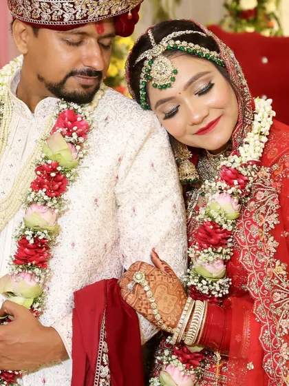 A close-up of the bride's serene expression, highlighting the soft eye makeup and flawless skin that enhances her natural beauty.