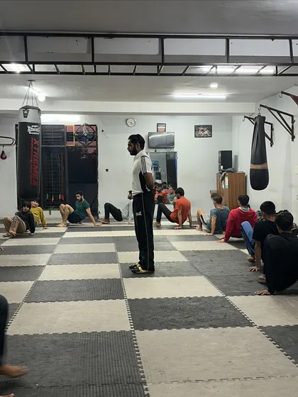 I oversee a group performing crab walks, a simple but effective exercise for conditioning the lower body and core. The focus and devotion of every student is what brings results.