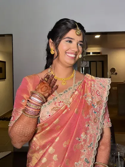 A candid moment from the Mehendi ceremony. The makeup is designed to look flawless from all angles and last throughout the event.