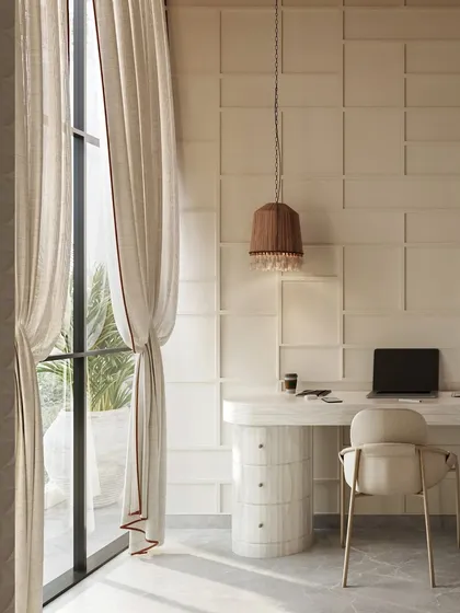 Natural light is a key element in a productive study area. Here, a minimalist desk is positioned by a large window with flowing linen curtains, creating a bright and airy environment perfect for learning and creativity.