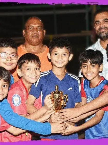 The Under-11 team celebrates their championship win at the GenNext Football Tournament, showcasing their skill and teamwork.