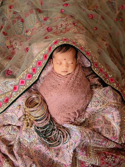 Celebrating culture and new life together. This beautiful setup incorporates a mother's traditional dupatta, creating a meaningful and deeply personal portrait of her newborn.