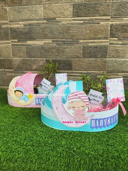 Our baby shower pram hampers are available in both pink and blue themes.