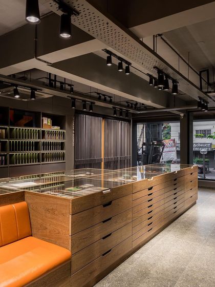 A static view of the central display island, showcasing its clean lines and the vast library of materials it holds.