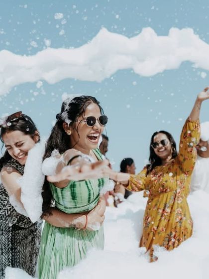 Friends and fun in the foam! Capturing the collective joy and energy of a pre-wedding foam party.