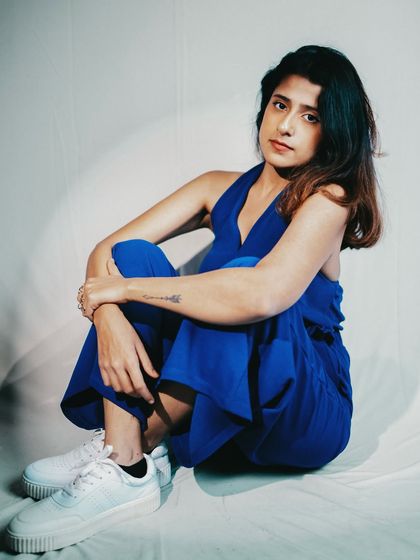 A pensive moment during a photoshoot.