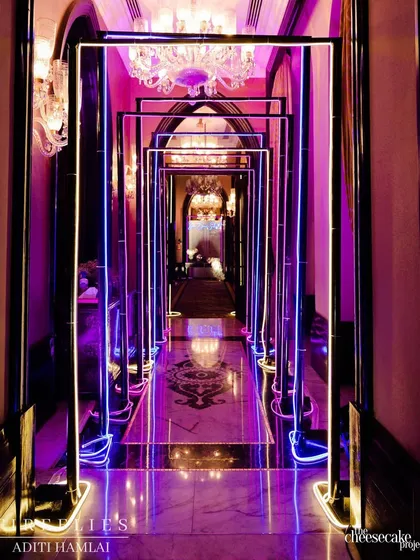 The entrance tunnel for the Sangeet, lined with glowing neon frames. This created a futuristic and high-energy welcome, setting the tone for the party inside.