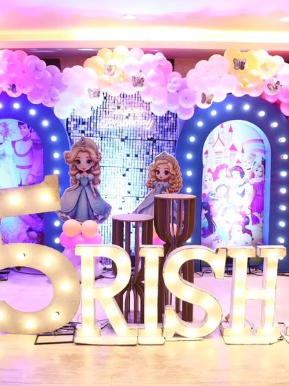 The princess party stage illuminated with different lighting, showing how we use lights to change the mood and highlight the decor.