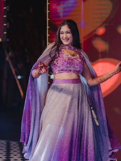 Capturing the pure joy of a Sangeeth night. For Surabhi's performance, I created a radiant look with shimmering eyes and a hairstyle that's both elegant and secure, ensuring she could dance the night away without a worry.
