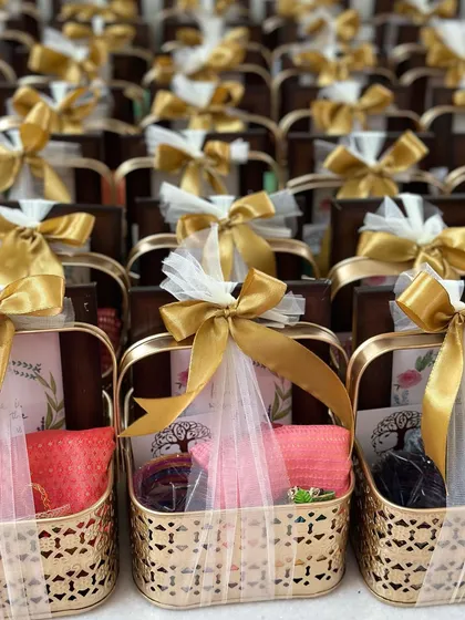 We curate thoughtful favors for personal milestones, like these housewarming gift baskets. Each basket is elegantly wrapped and filled with items to celebrate a new beginning, making guests feel truly appreciated.