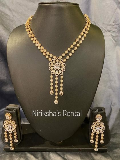 A delicate and modern diamond-look necklace set for rent, perfect for a cocktail gown or a simple lehenga.