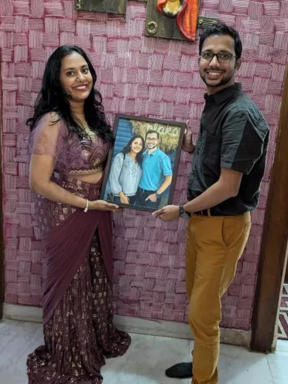 The happy couple with their finished custom portrait. Seeing my clients with their paintings is the best part of my job.