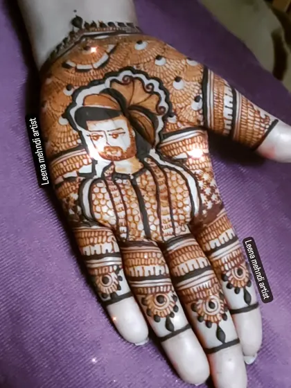 An example of my portrait work, capturing a groom's likeness on the palm. In my specialized portrait course, I teach the shading and line control techniques needed to create realistic figures in henna.