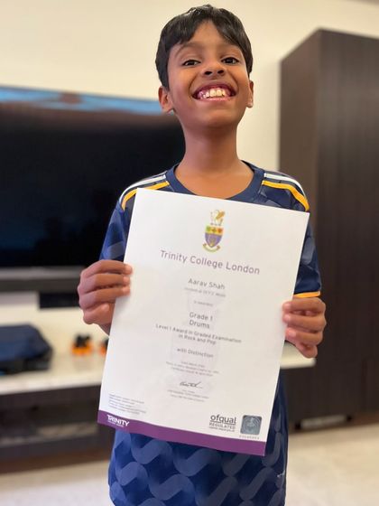Look at that smile. Congratulations to Aarav for scoring a distinction in his Trinity Grade 1 drums examination. Fantastic work.