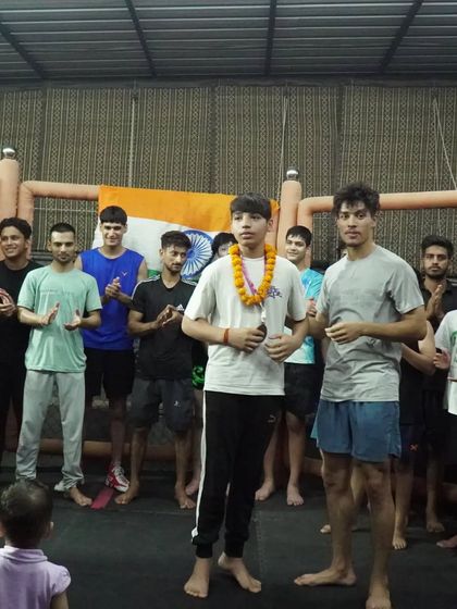 Our young champions being recognized by the team after their success in the kickboxing tournament.