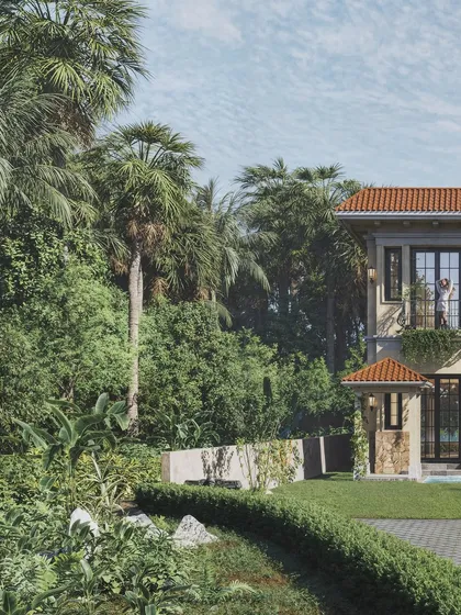 A partial view of the Goan villa, revealing its classic Mediterranean features like the Juliette balcony and terracotta roof. The surrounding palm trees and greenery were rendered to feel authentic to the Goan landscape.