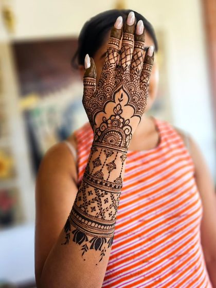 The "peek-a-boo" pose is a bride favorite! It's a great way to show off the detailed work on the back of the hand and forearm.