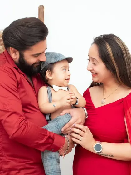 A candid family photo that shows the natural dynamic between parents and their baby. These are the real moments you will want to remember.