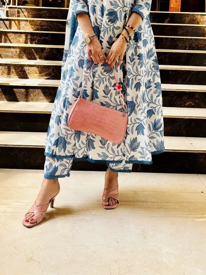 A detail shot of a blue and white floral kurta set, focusing on the pink accessories that add a lovely pop of color. This shows how I coordinate my entire look.