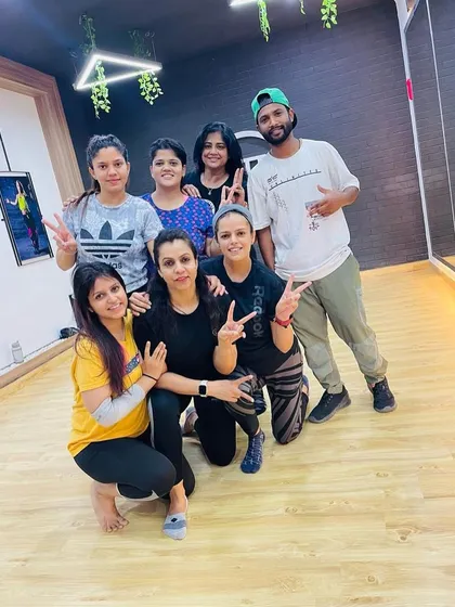 All smiles after a tough but rewarding fitness class with our instructor, Arun. The shared energy and support make every workout better.