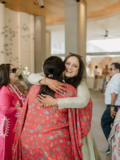 Guest experience is paramount. Here, a guest is warmly welcomed with a hug, showing the personal and heartfelt atmosphere I strive to create.