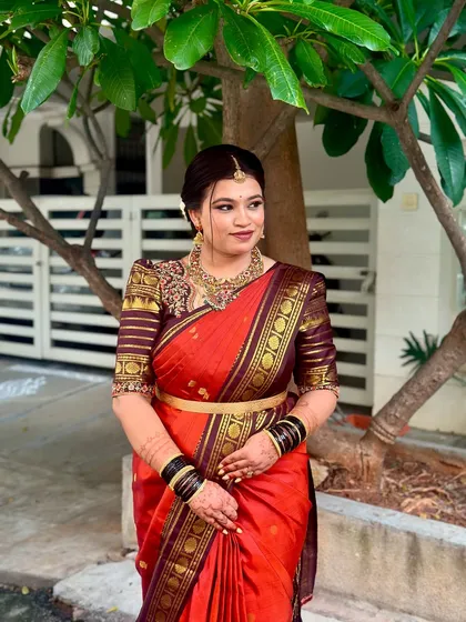I love the timeless beauty of a bride in a classic red silk saree. For this look, I created a warm, golden-hour glow on the skin with bold, defined eyes to match the richness of her traditional attire and temple jewellery.