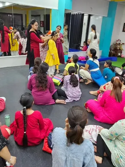 Another view of our costume and makeup workshop. Students gather around to learn from an expert, gaining practical skills that are essential for a performer.