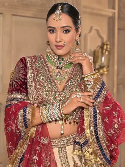 This is a classic, regal bridal look that never goes out of style. I focused on creating a majestic feel with rich tones on the eyes, a perfectly sculpted base, and a velvety lip color to match the royal velvet lehenga.