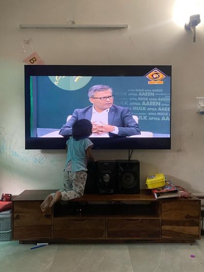A personal moment at home, where my daughter was surprised to see me on a Doordarshan news debate discussing anti-corruption laws.